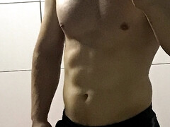 Sexy man taking a shower