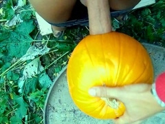Sexy twink passionately pounds a pumpkin in the garden