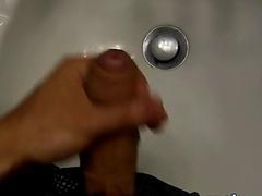 Fit jock teases with his big dick and jerks off