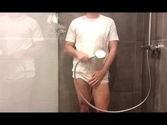 Amateur chubby guy Shycummerboy shows off a striptease in the shower wearing white briefs and a tee