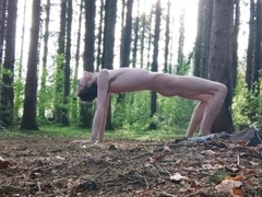 Bony nubile leans his smallish backside over in the forest