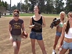 Coach shows 2 athletes how to properly handle a big bat