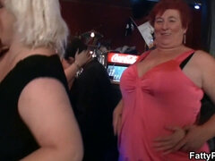 Watch these curvy party girls go wild with their massive tits and huge dicks in a BBW bar