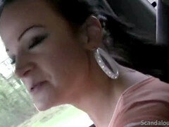 Sexy babe stroking a cock while the guy behind the wheel gets filmed