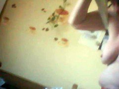 Her tits changing in the kitchen