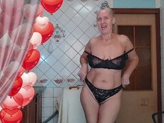 Red-hot housewife Lukerya struts in black lingerie while cooking in the kitchen