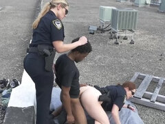 Two chubby female cops fucking with a black man on the roof