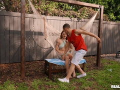 Gorgeous redhead babe pleasures Johnny outdoors