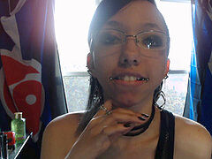 Beautiful lady in Glasses Applies Lip glitter and Tongue teases Glass Dildo