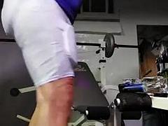 Football  practice uniform and coach relaxing after team leaves