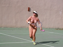 Undressed playing tennis
