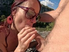 Tattooed milf with blue eyes enjoys deep throat outdoor session leading to climactic ending