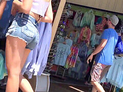 Voyeur teen captures cute blonde in tight jean shorts