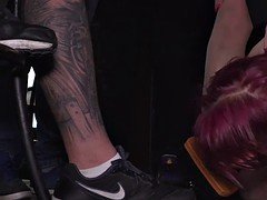 Bound redhead cleaning shoes in public bar