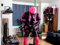 Sissy's self-restraint hanging in suspension