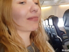 Naughty pilot's wife flaunts her voluptuous breasts in public on an airplane!