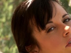 Beautiful girl dancing and stripping solo outdoors