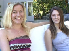 Blonde lesbian MILF fucks younger girl on the couch