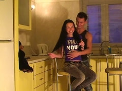 A kinky girl is getting touched in the kitchen by her boyfriend