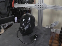 Gimp in latex is dominated and punished by a cruel lady