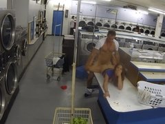A brunette with a sexy pussy is in the laundry room, handling the cock