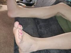 My girlfriend's adorable feet and vibrant red toes steal the show