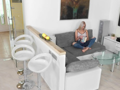 Beautiful blonde woman rubbing her tight pussy at home