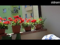 Old mature masturbating on the balcony