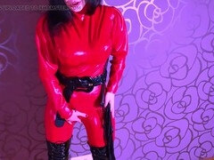 Dominant Karolina in red latex outfit humiliates guy slave