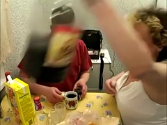 Russian mature mother with her stepson in the kitchen