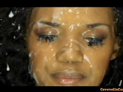 Ebony cutie gets face covered in sperm - bukkake orgy