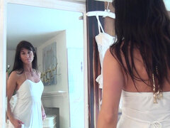 Brunette Lelani Tizzie enjoys her body in lingerie