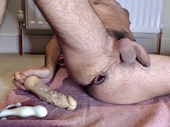 Fucking my ungreased hole hard with more and more dildos and a bottle