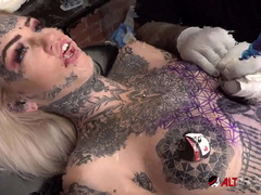 Amber Luke Gets Tattooed While Sascha Plays with Her Big Tits