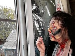 Wife smokes a cigarette makeup zombie