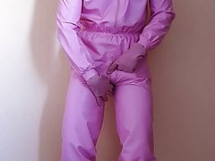 Gummiboy wanks his small penis in pink rubber and latex