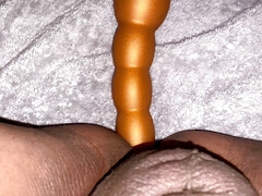 Taking a long butt plug