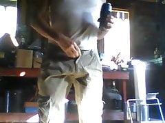 in the garage pissing