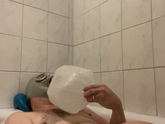 Latex twink in a breath control gas mask enjoys some kinky bath breathplay and double climax