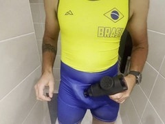 Muscular guy proudly showcases his bulging cock in a new wrestling singlet resulting in massive loads of jizz