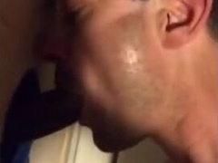 Amateur sucks big black cock at glory hole