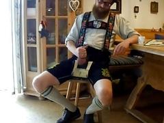 Kinky bastard pulls his dick out of lederhosen for masturbation