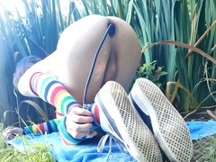 Slim femboy Raine enjoys massive inflatable dildo play in the great outdoors!