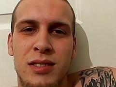 Tattooed thug pulls his cock out to jerk off solo