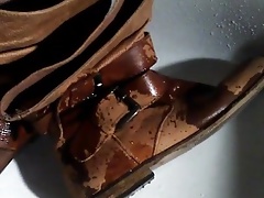 pissing in brown leather boots