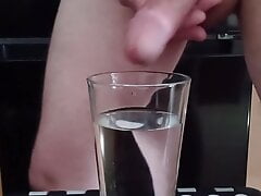 Cumming in a glass of hot water