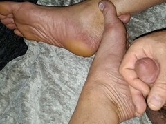 Horny hairy grandpa masturbating with foot worship in close-up