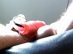 My balls weighted down by a steel weight my electrified cock