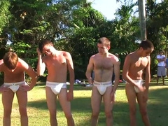 Two young studs get frisky with each other, touching and groping each other's bodies