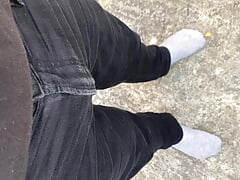 Pissing my black jeans outside